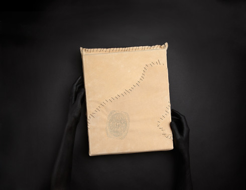 Stranger_HolidayBook_leatherwHands_F